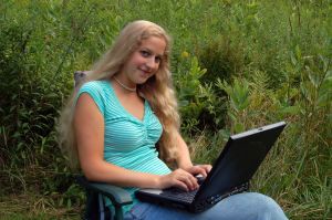 student-with-computer-outdoors-863796-m